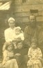 Фёкла Тимиева с дочерью Еленой на руках, Михаил Тимиев, ниже в центре их сын Николай